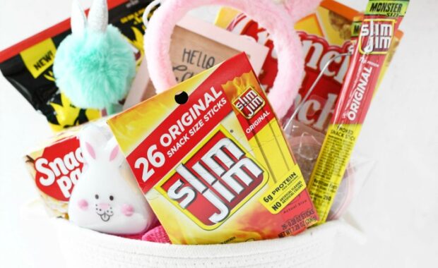 pink and white knit bucket with Slim Jims and bunny ears inside. childs hand on bunny ears.